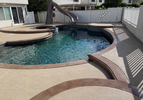 Pool remodel with surrounding deck surface