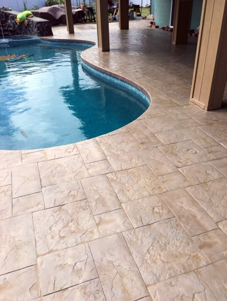 Poolside concrete and stone deck surface